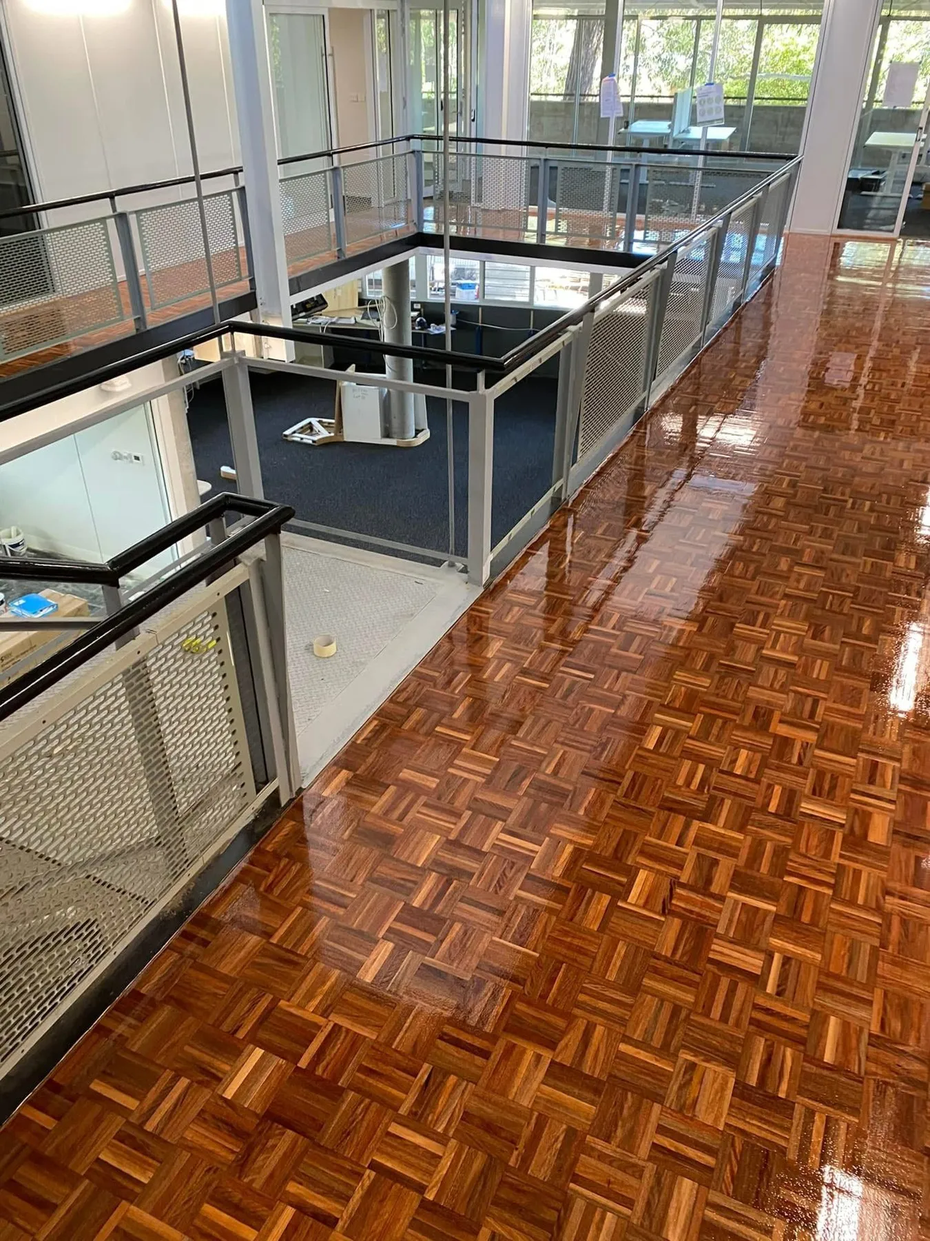 Polished parquetry timber floor with a high gloss finish